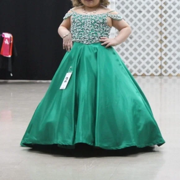 Tiffany size 10. Corset back. It has been hemmed however it can be let out.